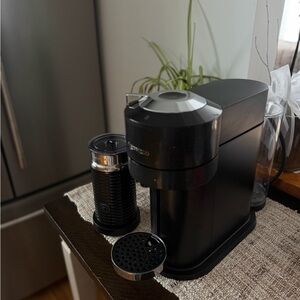 Nespresso Black Coffee Machine with Silver Accents